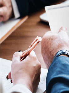 Man and woman review financial documents